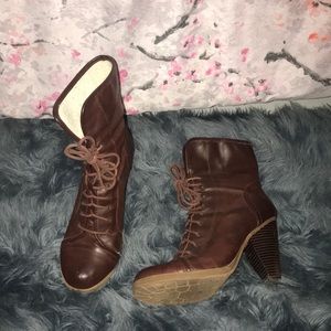 Closed toe high heeled boots.